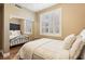 Comfortable bedroom with mirrored closet doors and bright, shuttered windows at 2323 Carinth Way, Henderson, NV 89074