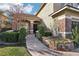 Charming front entrance with manicured landscaping, stone accents, and a welcoming walkway at 2323 Carinth Way, Henderson, NV 89074