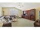 Spacious living room boasts custom built-ins, large window and comfortable seating at 2323 Carinth Way, Henderson, NV 89074