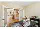Bright office space with hardwood floors and arched entry to living area at 2323 Carinth Way, Henderson, NV 89074