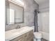 Updated bathroom features a modern vanity, framed mirror, and tiled shower and tub at 251 S Green Valley Pkwy # 3412, Henderson, NV 89012
