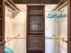 Walk-in closet features custom shelving, drawers, and ample hanging space for organization at 251 S Green Valley Pkwy # 3412, Henderson, NV 89012