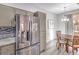 Dining area features stainless steel refrigerator and a modern light fixture and room for four at 251 S Green Valley Pkwy # 3412, Henderson, NV 89012