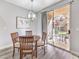 Well-lit dining area boasts a sliding glass door leading to an outdoor patio at 251 S Green Valley Pkwy # 3412, Henderson, NV 89012