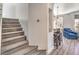 Welcoming entryway with staircase, open floorplan, and stylish breakfast bar at 251 S Green Valley Pkwy # 3412, Henderson, NV 89012