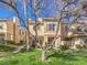 Charming two-story exterior of the property with well-maintained lawn and mature trees on a sunny day at 251 S Green Valley Pkwy # 3412, Henderson, NV 89012