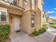 Attractive townhome entrance with a charming front door, manicured bushes, and walkway at 251 S Green Valley Pkwy # 3412, Henderson, NV 89012