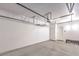 Spacious two-car garage with overhead storage racks, bright lighting, and an access door at 251 S Green Valley Pkwy # 3412, Henderson, NV 89012