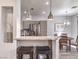 Kitchen area with stainless appliances and barstool seating at the granite-topped island at 251 S Green Valley Pkwy # 3412, Henderson, NV 89012