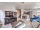 Open-concept living area showcases modern finishes, a kitchen bar, and hardwood floors at 251 S Green Valley Pkwy # 3412, Henderson, NV 89012