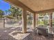 Covered outdoor patio featuring a built-in grill, seating, and views of the community pool at 251 S Green Valley Pkwy # 3412, Henderson, NV 89012