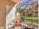 Inviting outdoor patio featuring comfortable seating and a view of the well-maintained lawn at 251 S Green Valley Pkwy # 3412, Henderson, NV 89012