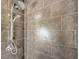 Close-up of modern showerhead with sleek fixtures and tiled walls at 251 S Green Valley Pkwy # 3412, Henderson, NV 89012