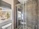 Contemporary bathroom features a glass-enclosed shower with stone floors and tiled walls at 251 S Green Valley Pkwy # 3412, Henderson, NV 89012