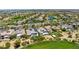 Expansive aerial view of luxury homes nestled on a golf course in a beautiful community at 2623 Turtle Head Peak Dr, Las Vegas, NV 89135