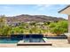 Stunning backyard pool with water feature and lush landscaping, offering a serene outdoor retreat at 2623 Turtle Head Peak Dr, Las Vegas, NV 89135