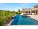 Inviting backyard oasis with a sparkling pool, spa, and lush landscaping, creating a relaxing atmosphere at 2623 Turtle Head Peak Dr, Las Vegas, NV 89135