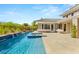 Stunning backyard pool featuring a spa and a serene waterfall feature, perfect for luxurious outdoor living at 2623 Turtle Head Peak Dr, Las Vegas, NV 89135