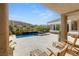 Inviting backyard pool and spa area with lounge chairs, perfect for relaxation with mountain views at 2623 Turtle Head Peak Dr, Las Vegas, NV 89135