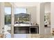 Wet bar with mountain views from the bar's serving window to outdoor space at 2623 Turtle Head Peak Dr, Las Vegas, NV 89135