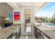 Modern wet bar featuring a large window that looks out to the pool and backyard at 2623 Turtle Head Peak Dr, Las Vegas, NV 89135