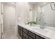 Double sink bathroom with granite countertops, modern fixtures, and a glass-enclosed shower at 2623 Turtle Head Peak Dr, Las Vegas, NV 89135