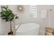 Modern bathroom featuring a freestanding tub, stylish fixtures, and a neutral color scheme at 2623 Turtle Head Peak Dr, Las Vegas, NV 89135
