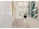Bright foyer featuring high ceilings, neutral tones, and decorative wall art at 2623 Turtle Head Peak Dr, Las Vegas, NV 89135