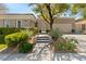 Inviting home exterior featuring desert landscaping, a paver walkway, and a well-maintained front yard at 2623 Turtle Head Peak Dr, Las Vegas, NV 89135