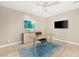 Stylish home office featuring wood floors, contemporary decor, and a spacious desk at 2623 Turtle Head Peak Dr, Las Vegas, NV 89135