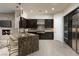 Beautiful kitchen with stainless steel appliances, granite counters and large island at 2623 Turtle Head Peak Dr, Las Vegas, NV 89135