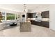 Open-concept kitchen with granite counters, stainless appliances, and a large island at 2623 Turtle Head Peak Dr, Las Vegas, NV 89135