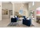 Stylish living room with modern furnishings, abundant natural light, and an integrated bar area at 2623 Turtle Head Peak Dr, Las Vegas, NV 89135