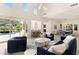 Open living area with seamless flow to the outdoors, tall windows, and elegant furnishings at 2623 Turtle Head Peak Dr, Las Vegas, NV 89135