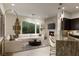 Open-concept living space featuring a cozy fireplace and a modern kitchen at 2623 Turtle Head Peak Dr, Las Vegas, NV 89135