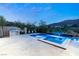Well-maintained pool and patio with an outdoor grill, perfect for entertaining guests and enjoying summer evenings at 2623 Turtle Head Peak Dr, Las Vegas, NV 89135