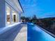 Tranquil backyard pool with a long, modern design that enhances the outdoor living experience, complemented by serene landscaping at 2623 Turtle Head Peak Dr, Las Vegas, NV 89135