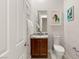 Chic powder room with elegant wallpaper, granite countertop, and contemporary fixtures at 2623 Turtle Head Peak Dr, Las Vegas, NV 89135