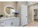 Well-lit bathroom with a walk-in shower, white vanity with marble counters, and modern fixtures at 2714 Langlade Ave, Henderson, NV 89052