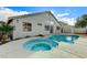 Backyard showcasing a swimming pool with an attached spa and a clear view of the home's rear exterior at 2714 Langlade Ave, Henderson, NV 89052