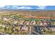 An aerial view of a residential area near a golf course, showing multiple homes at 2813 Vista Butte Dr, Las Vegas, NV 89134