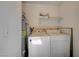 Laundry room with a washer and dryer and a water heater at 3151 Soaring Gulls Dr # 1010, Las Vegas, NV 89128