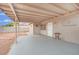 This covered back patio has a concrete floor and view to the backyard at 3305 Palomar St, North Las Vegas, NV 89030