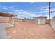 Wide open backyard featuring a detached structure and covered patio at 3305 Palomar St, North Las Vegas, NV 89030
