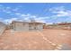 Backyard featuring a covered patio and stone path leading to detached building at 3305 Palomar St, North Las Vegas, NV 89030
