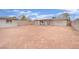 Spacious backyard featuring an outbuilding and partially covered patio at 3305 Palomar St, North Las Vegas, NV 89030