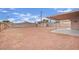 Large backyard with covered patio and small outbuilding, ready for customization at 3305 Palomar St, North Las Vegas, NV 89030
