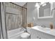 Well-lit bathroom featuring tub, shower and large vanity with ample storage at 3305 Palomar St, North Las Vegas, NV 89030