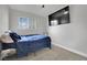 Bright bedroom with carpet, window, and door providing a comfortable and private space at 3305 Palomar St, North Las Vegas, NV 89030