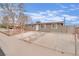 Charming single-story home with fenced yard and covered driveway, providing both privacy and curb appeal at 3305 Palomar St, North Las Vegas, NV 89030